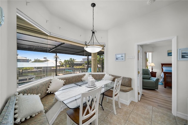 dining area with a wealth of natural light and light tile flooring