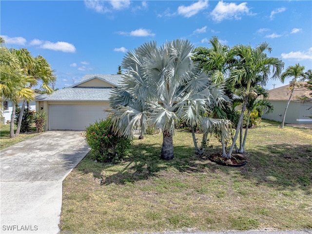 view of front of home featuring a garage and a front yard