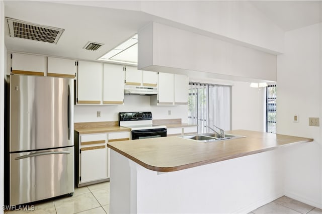 kitchen with sink, stainless steel fridge, light tile patterned floors, and electric range