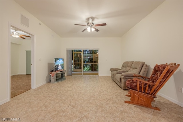 living room featuring ceiling fan and light tile flooring