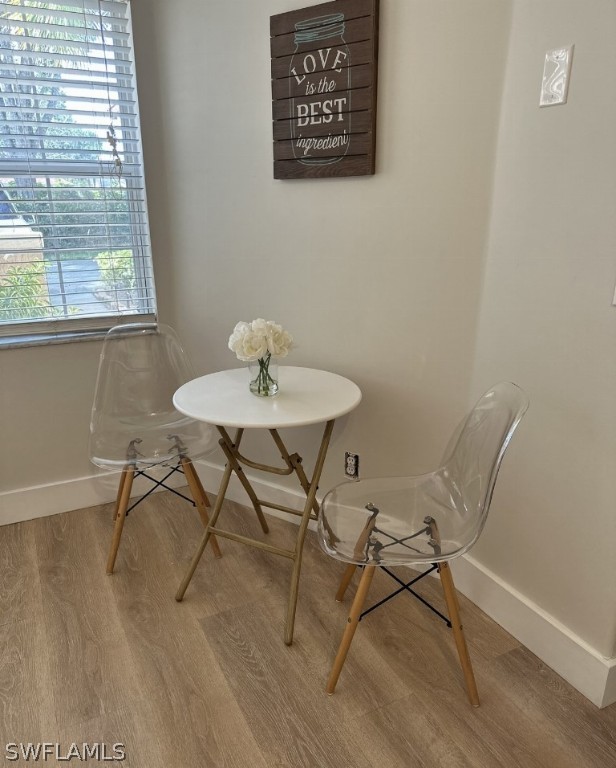 dining space featuring wood-type flooring