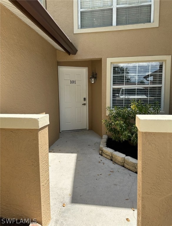 doorway to property with a patio area