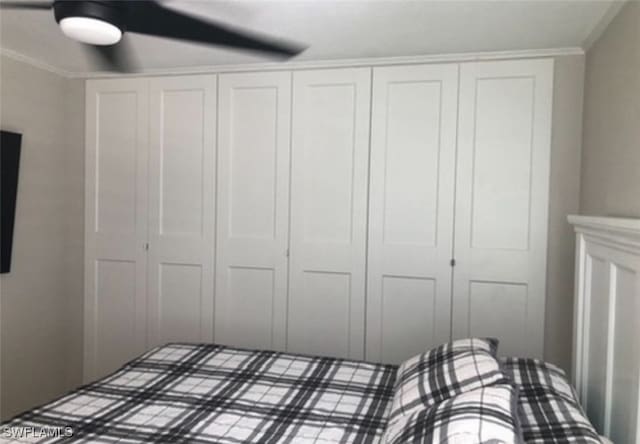 unfurnished bedroom featuring ornamental molding and ceiling fan