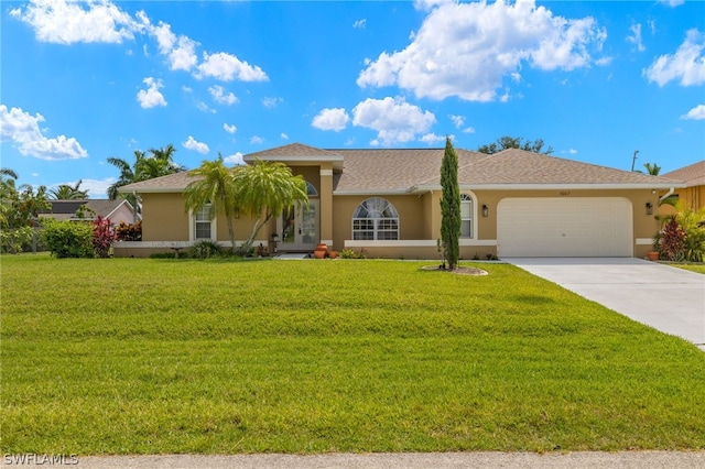 view of front of house with a garage and a front yard