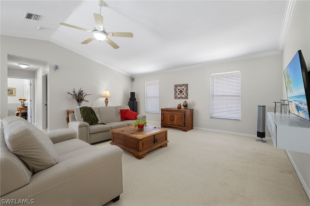 carpeted living room with a healthy amount of sunlight, ceiling fan, crown molding, and lofted ceiling