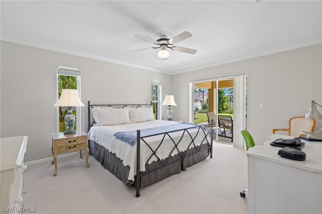 bedroom featuring ceiling fan, crown molding, light colored carpet, and access to outside