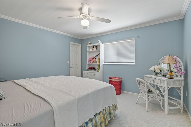 carpeted bedroom featuring ceiling fan and crown molding