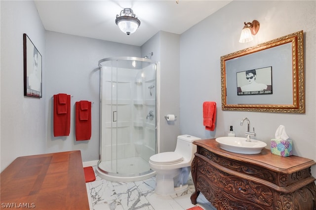 full bathroom with marble finish floor, toilet, a shower stall, vanity, and baseboards