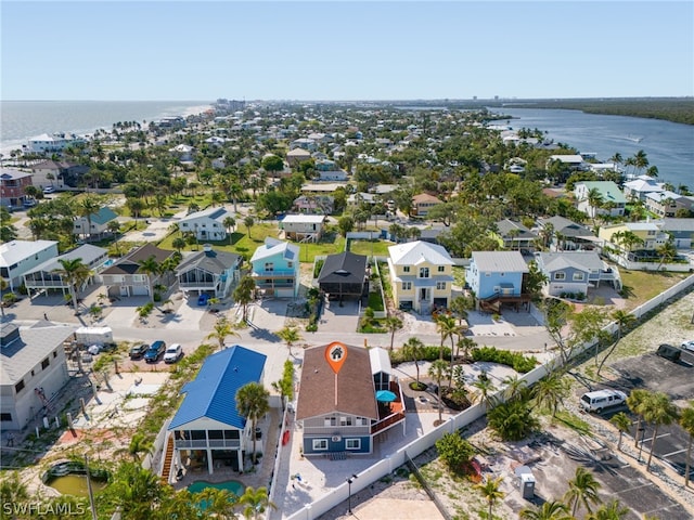 birds eye view of property with a residential view and a water view