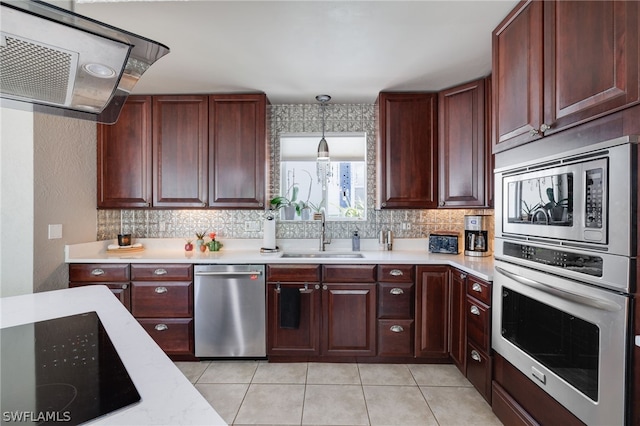 kitchen with tasteful backsplash, extractor fan, stainless steel appliances, a sink, and light tile patterned flooring