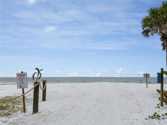 property view of water featuring a beach view