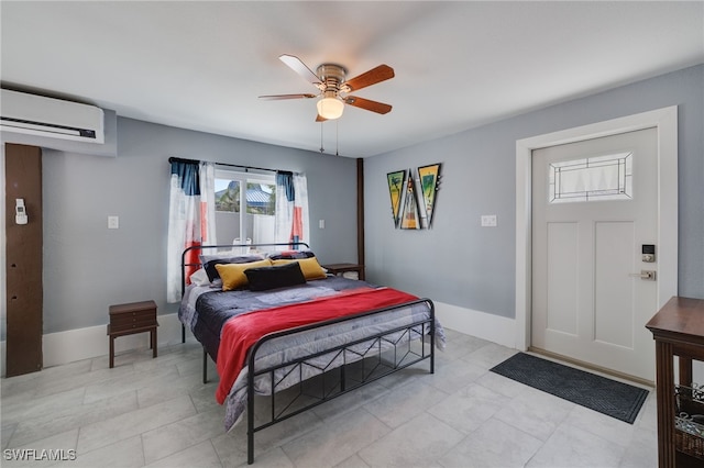 bedroom featuring baseboards, a ceiling fan, and a wall mounted air conditioner