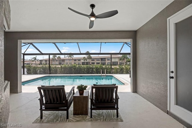 view of swimming pool featuring ceiling fan