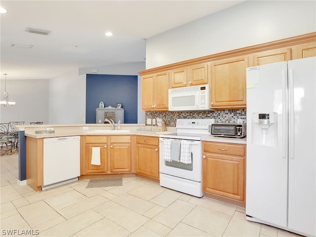 kitchen with white appliances, sink, decorative light fixtures, tasteful backsplash, and a notable chandelier