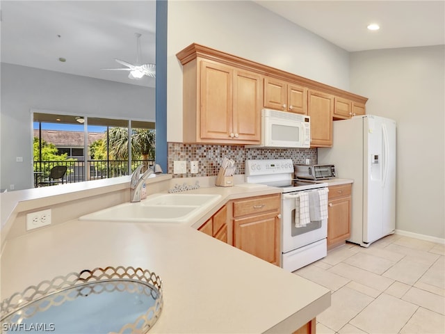 kitchen featuring light brown cabinets, white appliances, ceiling fan, and sink