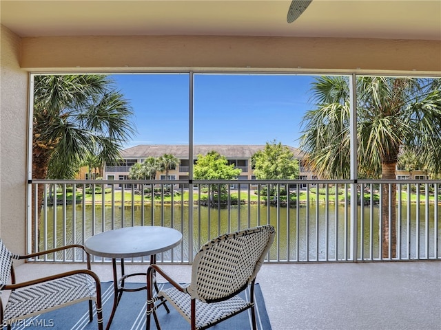 sunroom with a water view