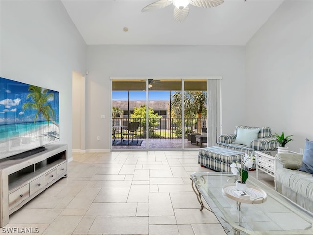 living room with ceiling fan and light tile patterned flooring