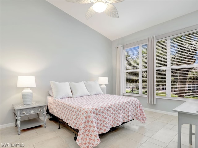 tiled bedroom featuring ceiling fan and lofted ceiling