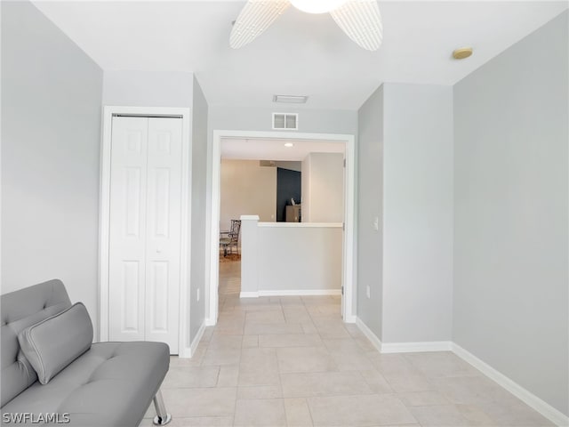 corridor with light tile patterned flooring