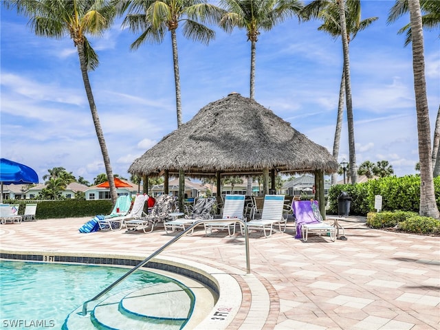 view of swimming pool with a gazebo and a patio area