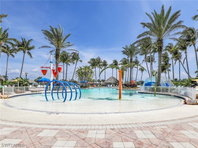 view of swimming pool featuring pool water feature