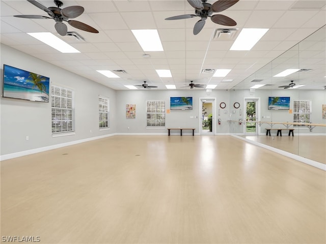 interior space with hardwood / wood-style floors and a paneled ceiling