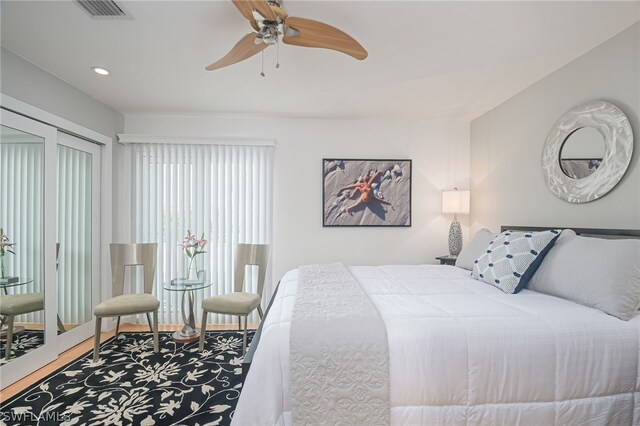 bedroom with ceiling fan and wood-type flooring