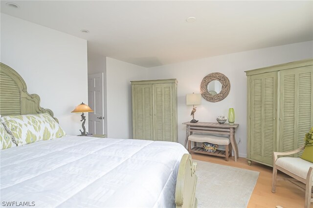 bedroom with light hardwood / wood-style flooring