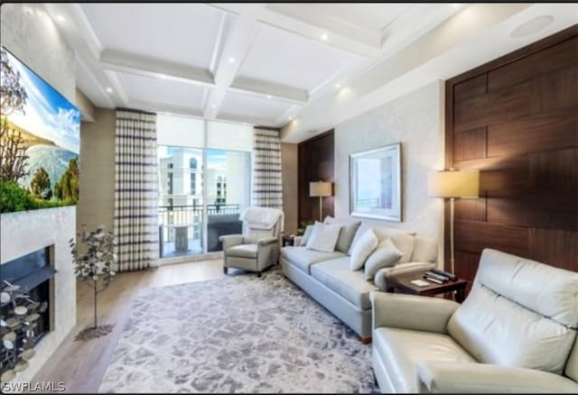 living room with coffered ceiling, beam ceiling, and hardwood / wood-style flooring