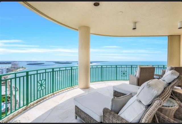 balcony featuring a water view