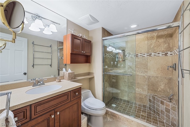 bathroom with tile floors, an enclosed shower, large vanity, and toilet