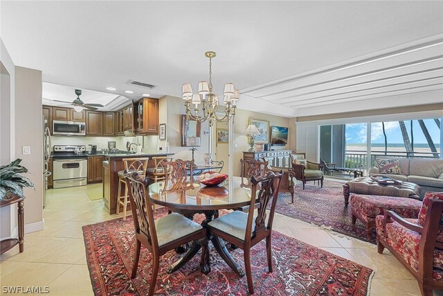 dining area with light tile floors and ceiling fan with notable chandelier