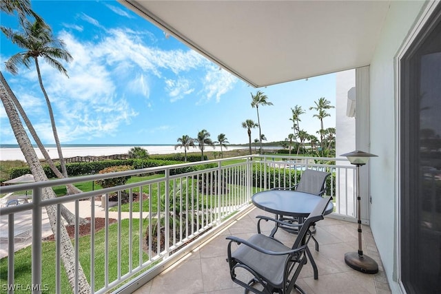 balcony featuring a water view