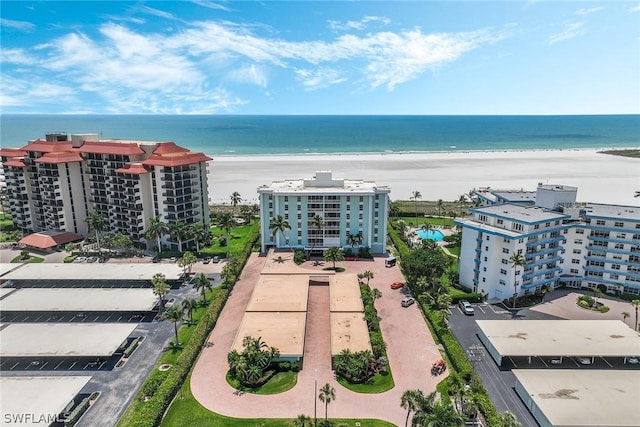 bird's eye view featuring a beach view and a water view