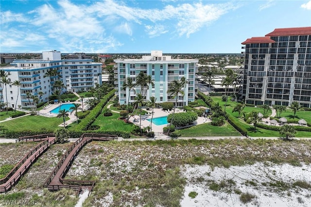 view of property featuring a community pool