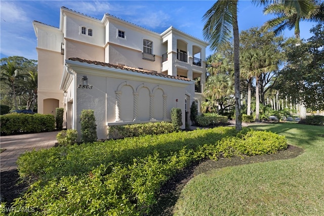 view of property exterior featuring a yard