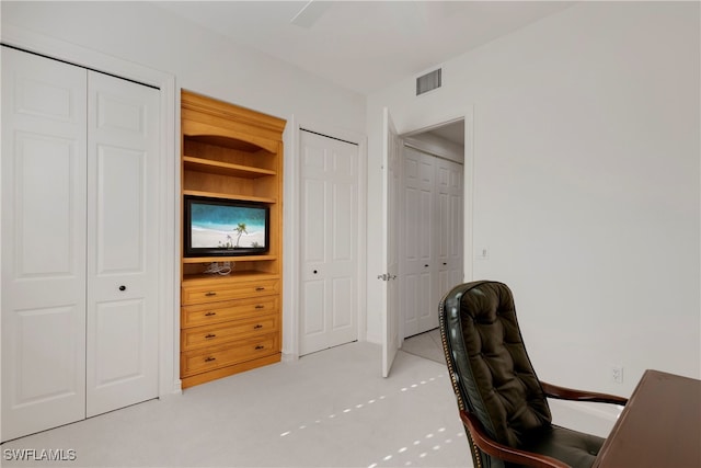 office area with built in features and light tile patterned floors