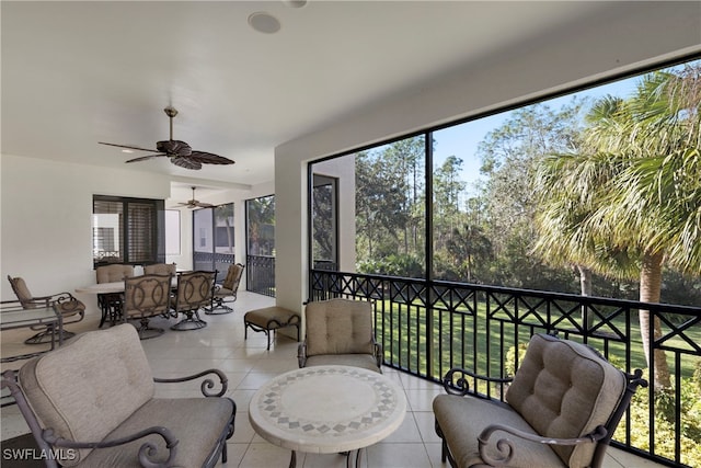 sunroom with ceiling fan and a healthy amount of sunlight