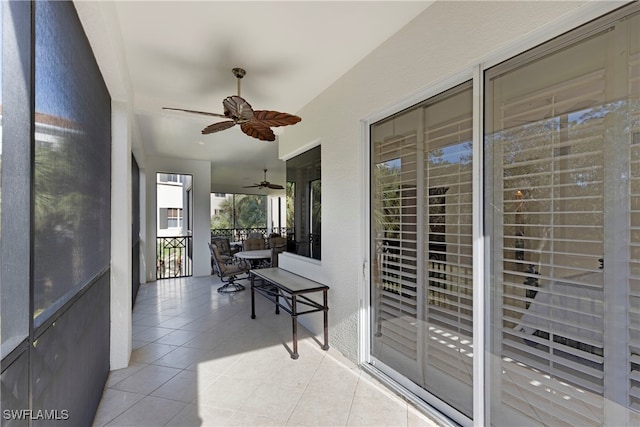 sunroom / solarium with ceiling fan