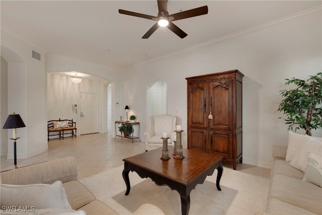 living room with ceiling fan, light tile patterned floors, and ornamental molding