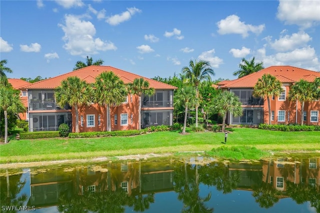 rear view of property featuring a water view