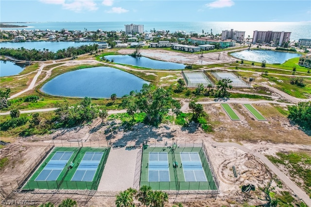 birds eye view of property with a water view