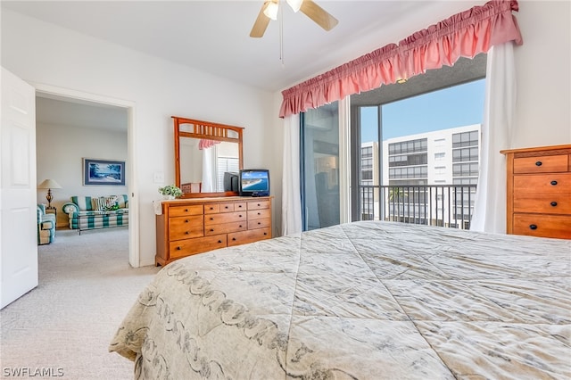 carpeted bedroom featuring multiple windows, ceiling fan, and access to outside