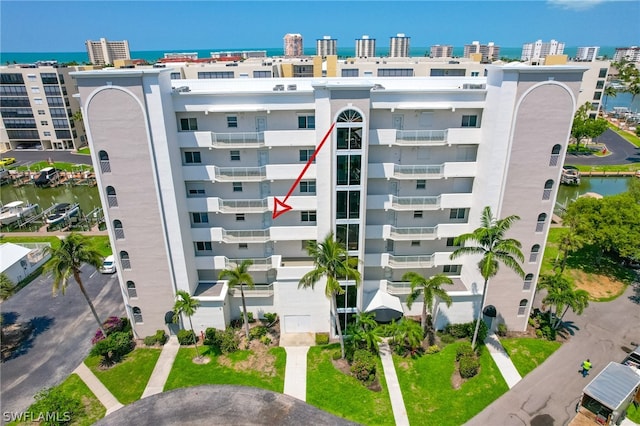 view of building exterior with a water view