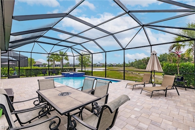 view of swimming pool with glass enclosure, an in ground hot tub, and a patio area