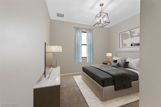 bedroom with a chandelier, baseboards, visible vents, and light colored carpet