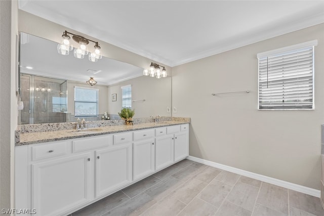 bathroom featuring a sink, baseboards, ornamental molding, a shower stall, and double vanity