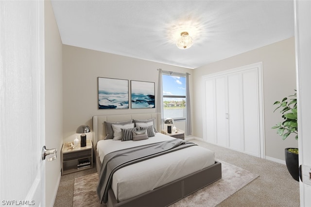 bedroom with carpet and baseboards