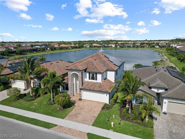 bird's eye view with a water view and a residential view