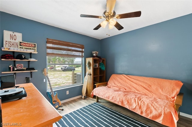 bedroom featuring ceiling fan and wood-type flooring